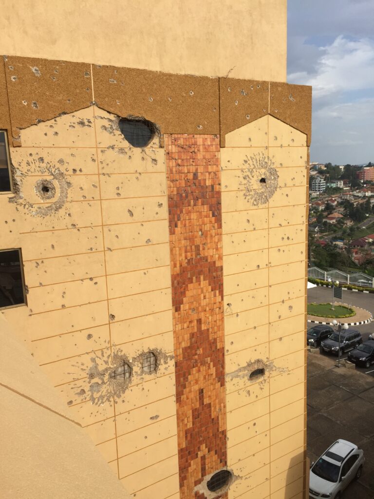 This photo of the Rwandan parliament building, taken in 2017 when I was conducting fieldwork, shows how the bullet and shell holes in the building from the genocide are still visible reminders of the violence. 